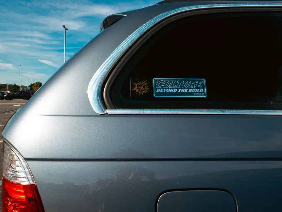 Culture Beyond The Build sticker in the rear window of a blue BMW 3 Series Touring