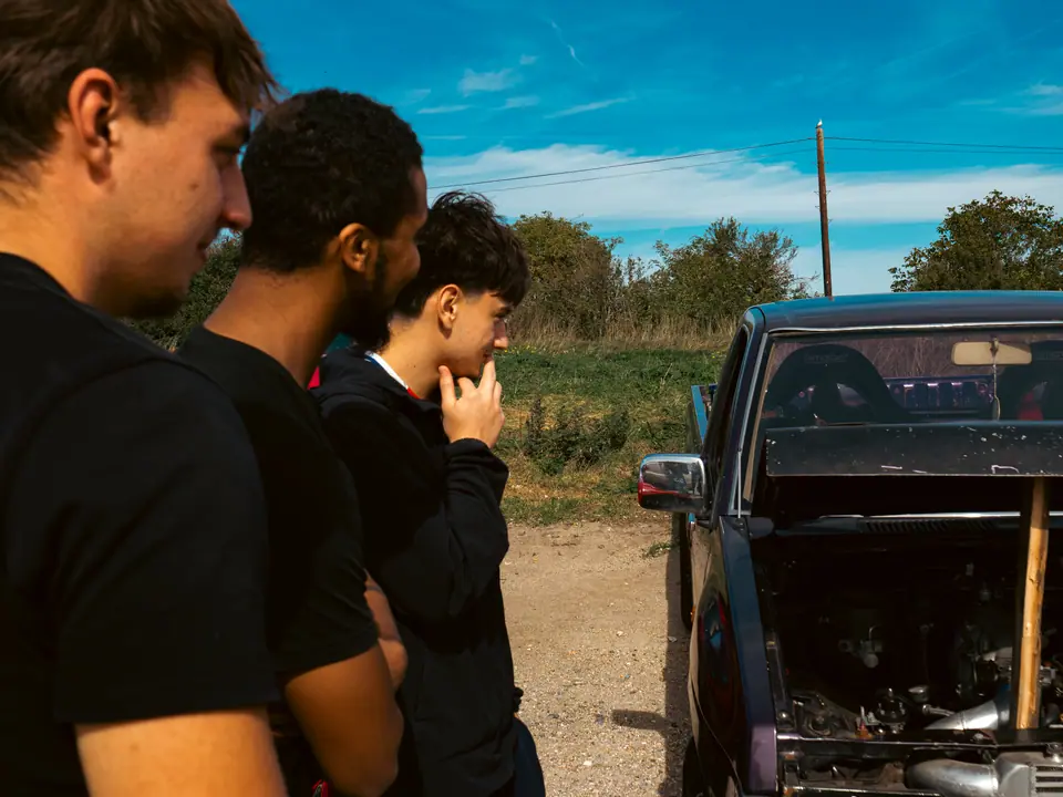 Close crop of friends studying the pick-up