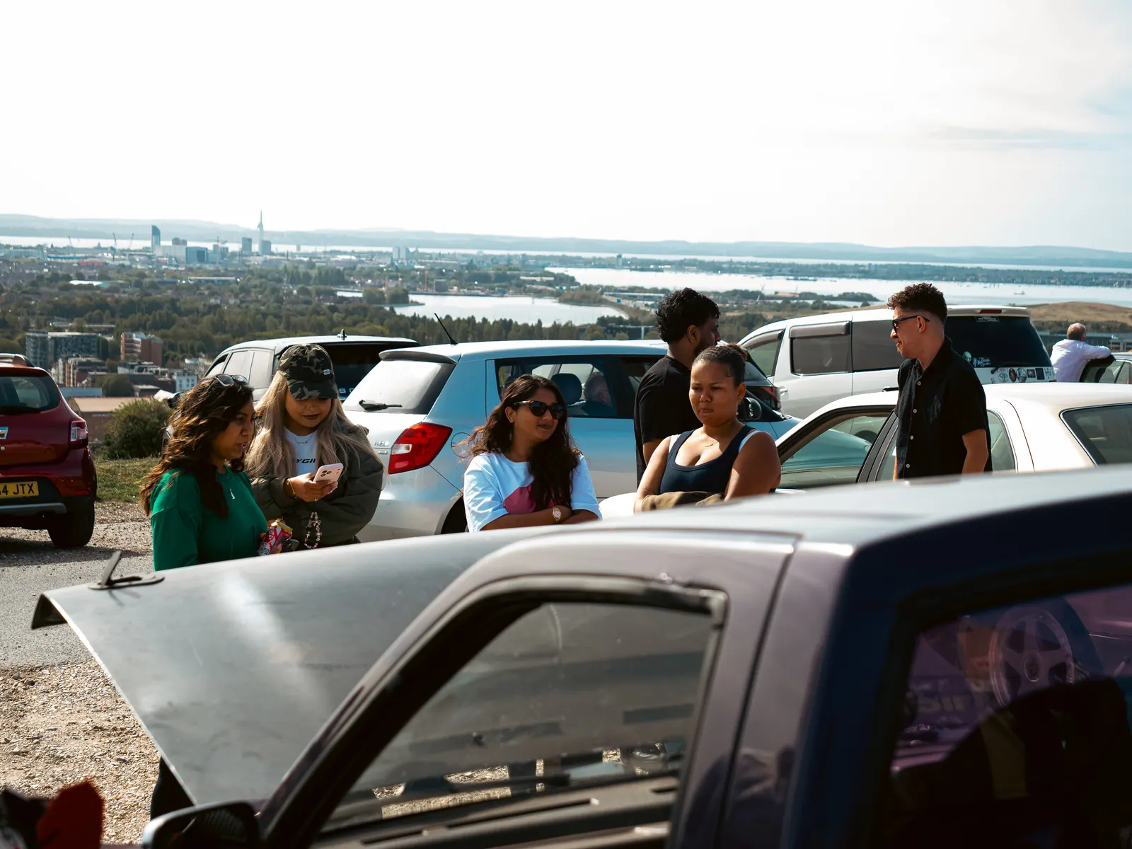 Friends chatting at the viewpoint over the city and harbour