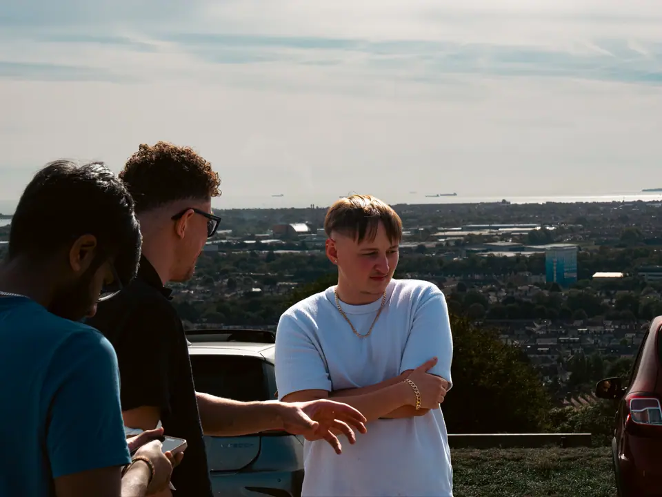 Pointing out the view from the hilltop