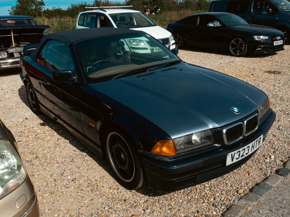 Dark blue BMW 3 Series Convertible, roof up
