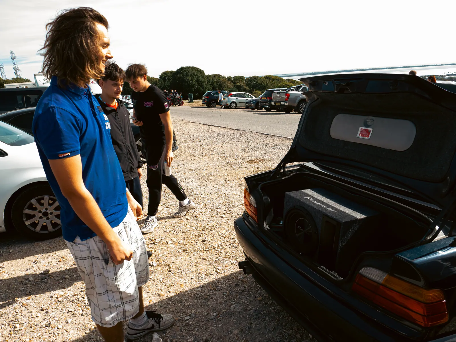 Boot open on the BMW convertible, subwoofer on show