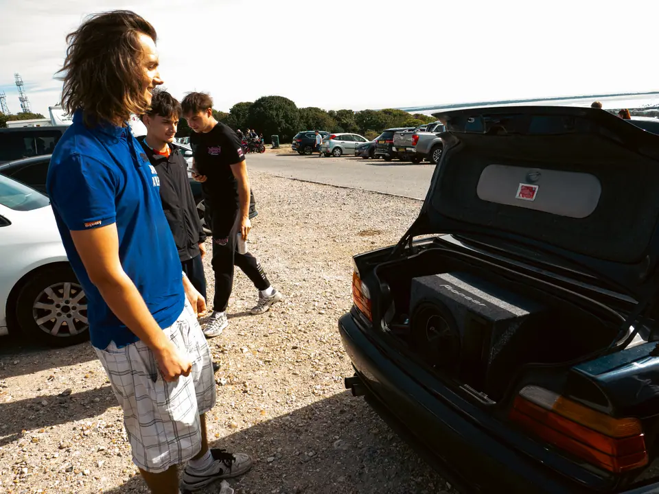 Boot open on the BMW convertible, subwoofer on show