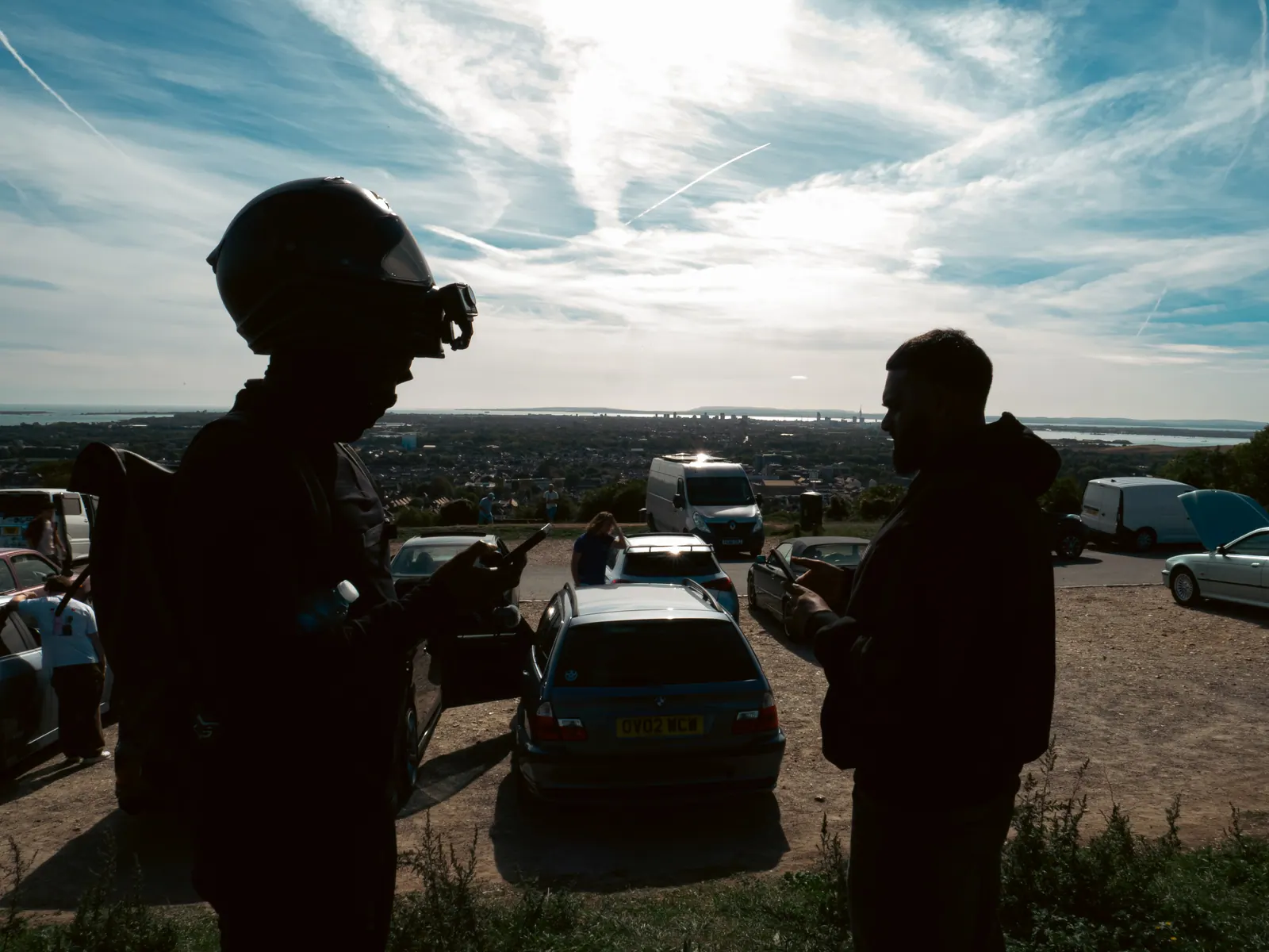 Silhouettes against the sky at the hilltop