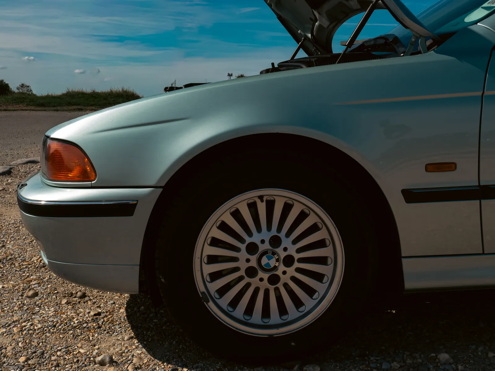 Multi-spoke wheel on a silver BMW 5 Series