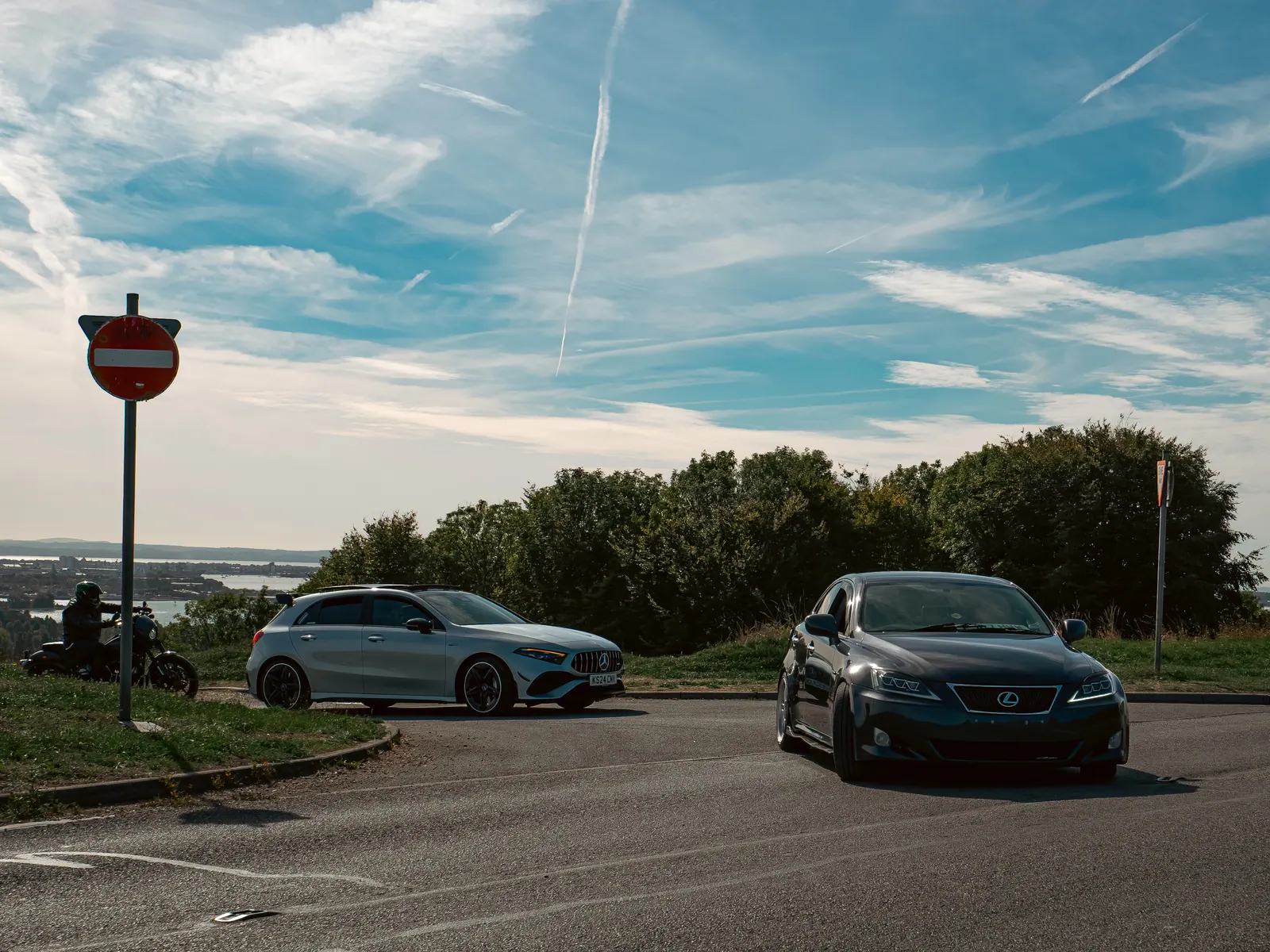 Mercedes-AMG A-Class and black Lexus IS heading out