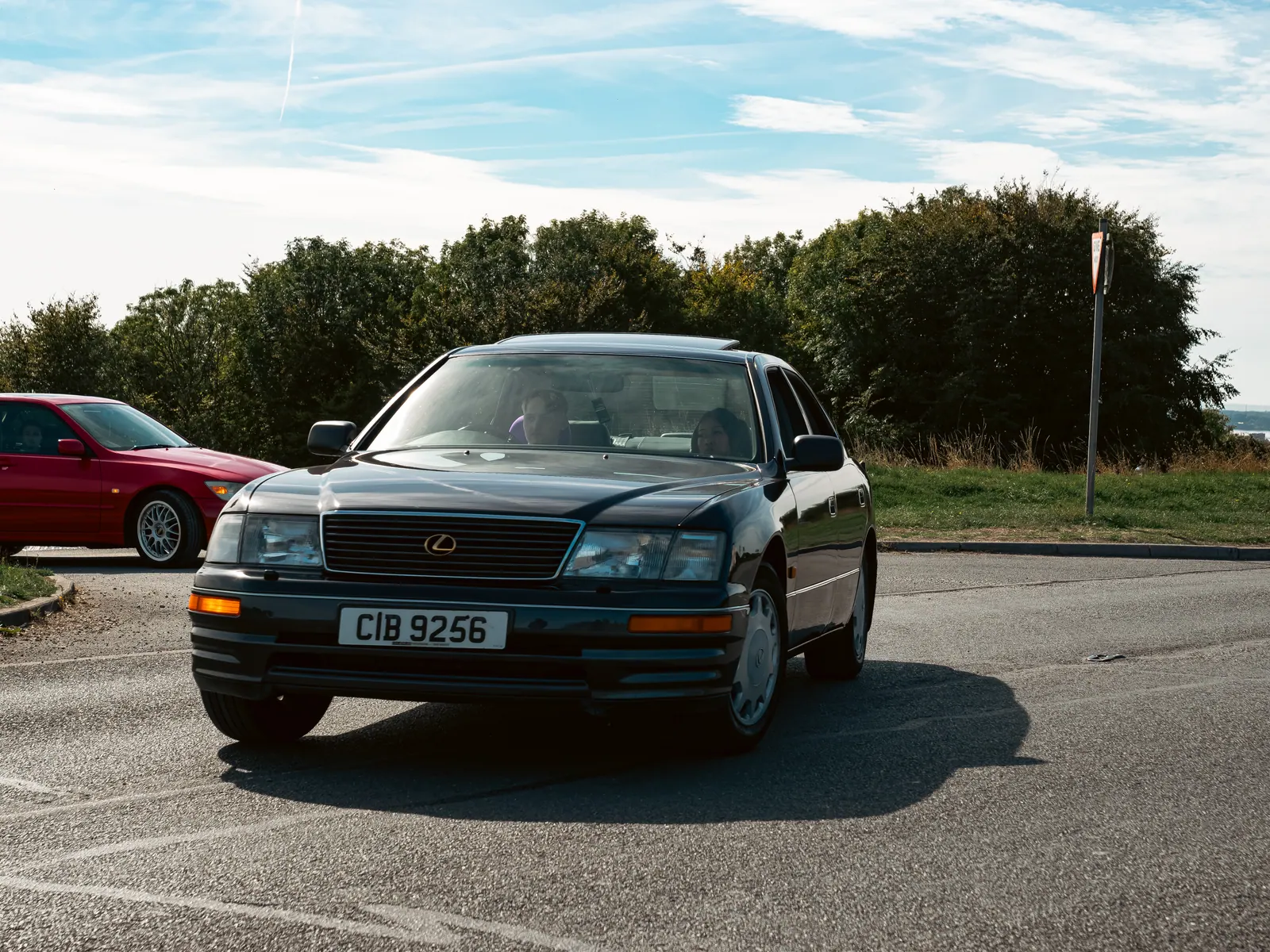Dark green Lexus LS head-on