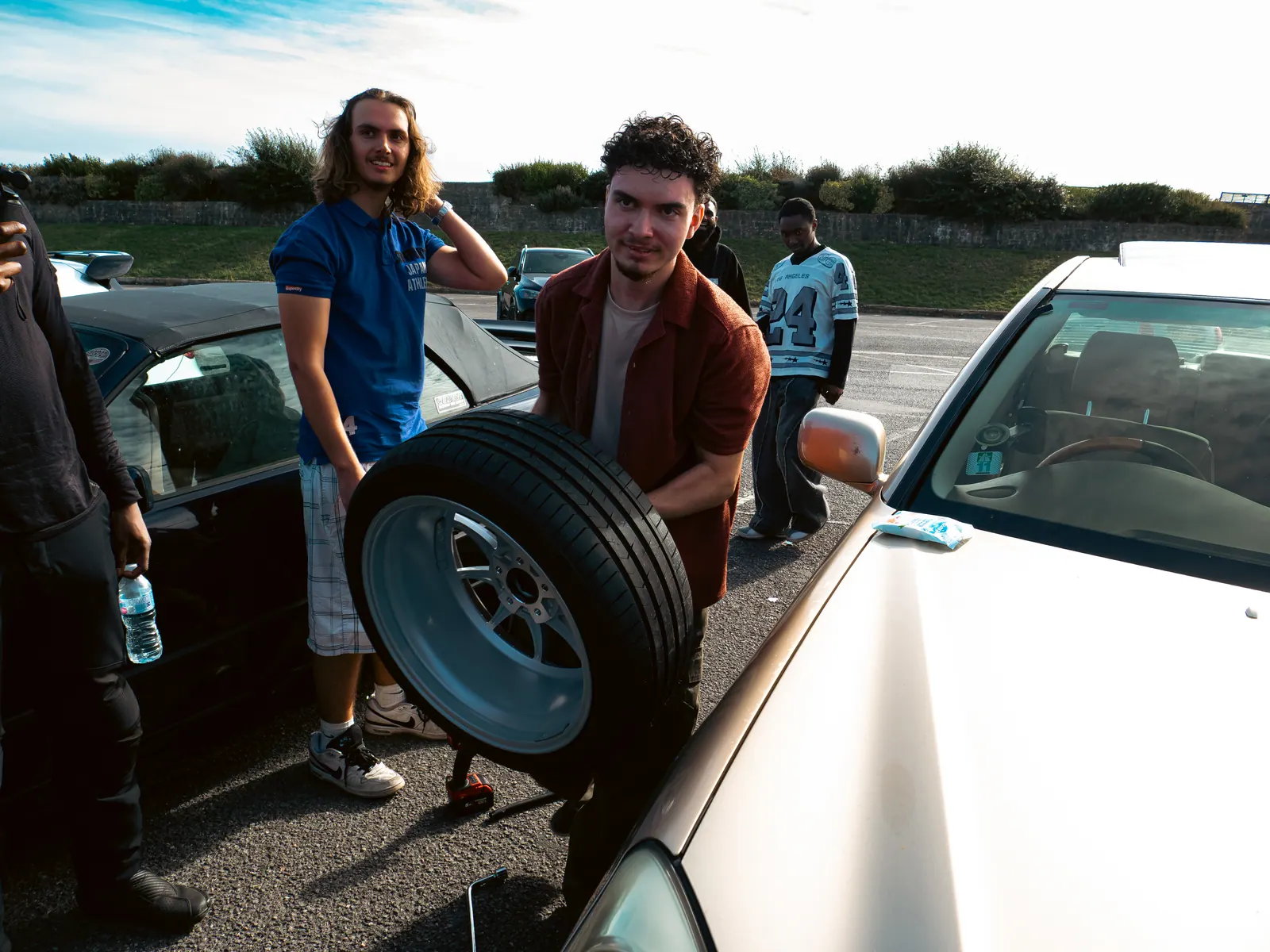 Carrying a fresh wheel over to the gold Lexus LS
