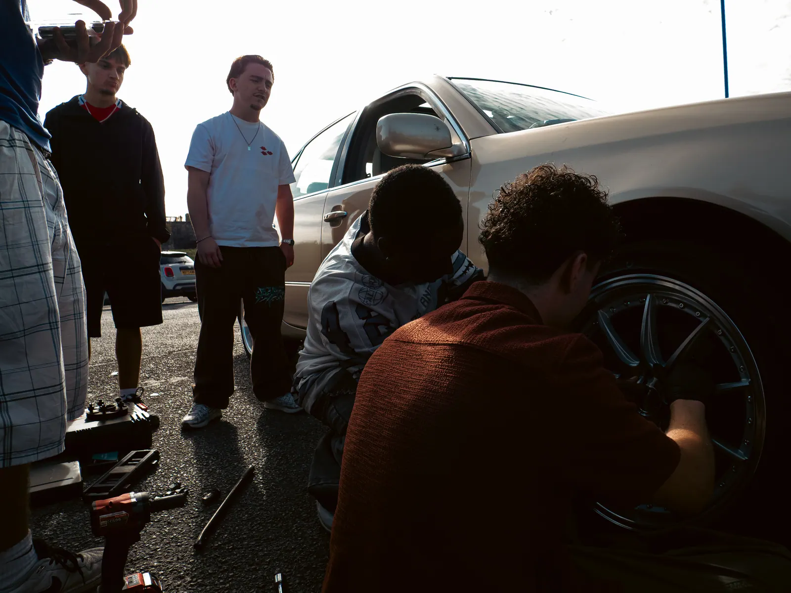 Tightening wheel nuts while everyone watches