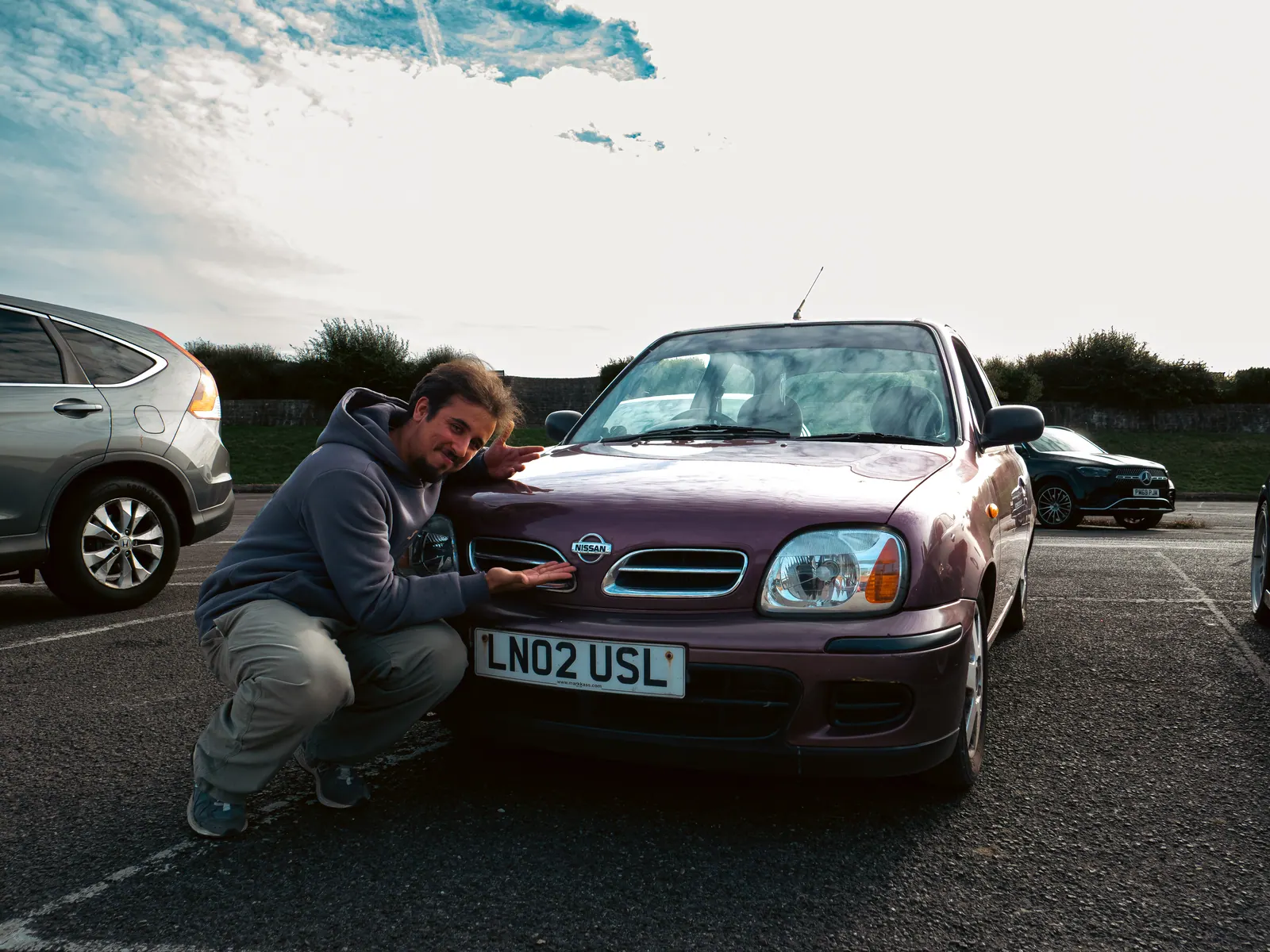 Posing with the purple Nissan Micra