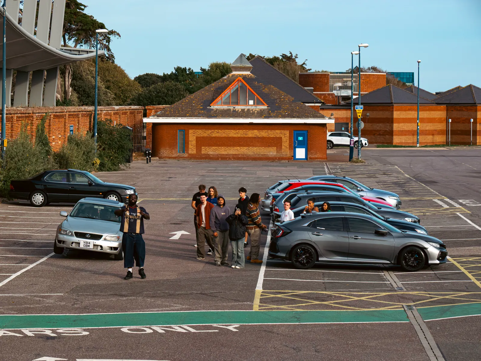 Lining up a group photo in the car park