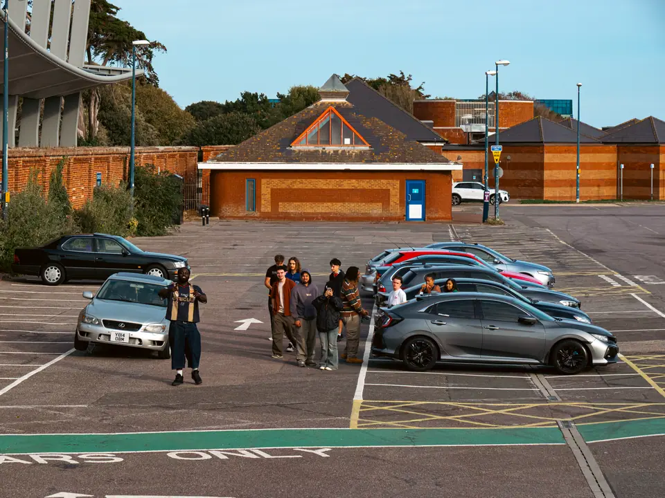 Lining up a group photo in the car park