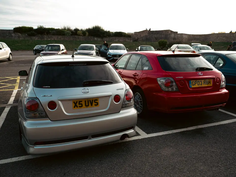 Silver Lexus IS SportCross and red Lexus IS parked up