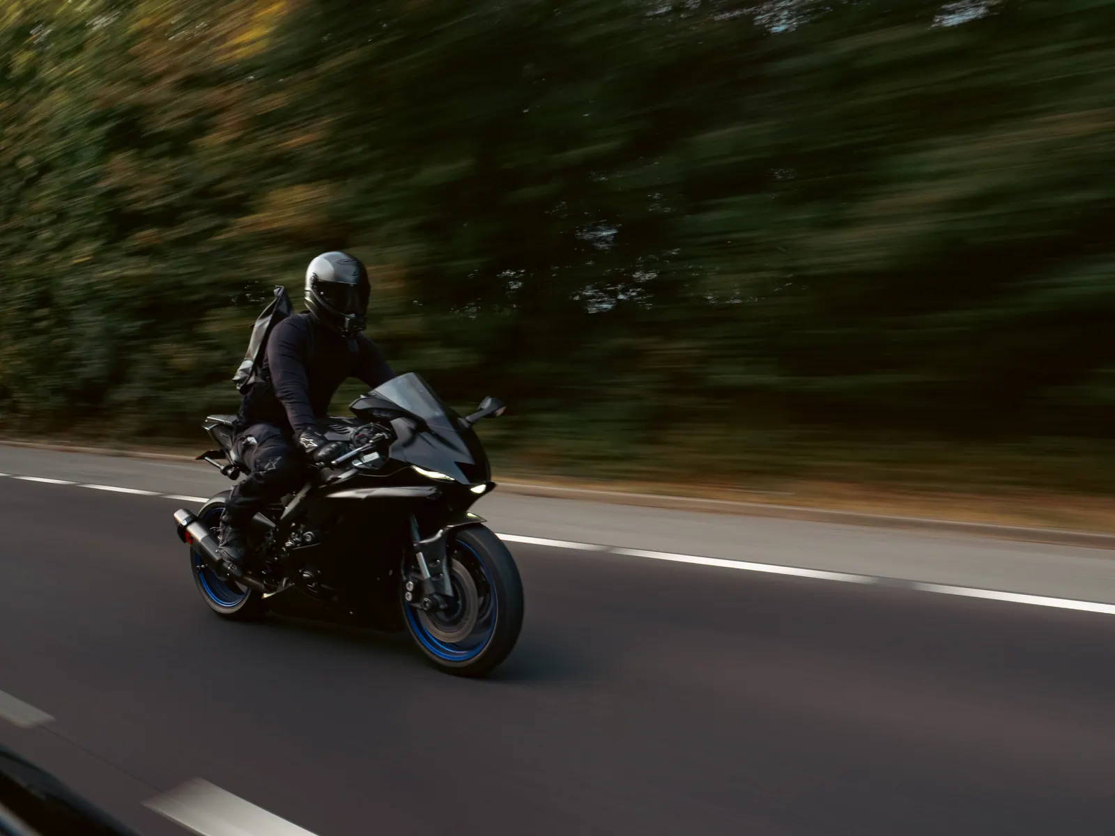 Sports bike against blurred trees