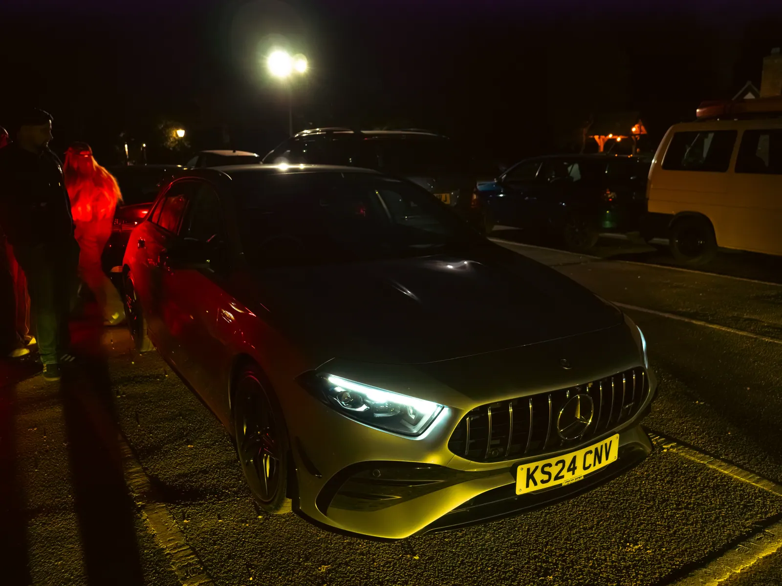 Silver Mercedes-AMG A-Class under a street lamp