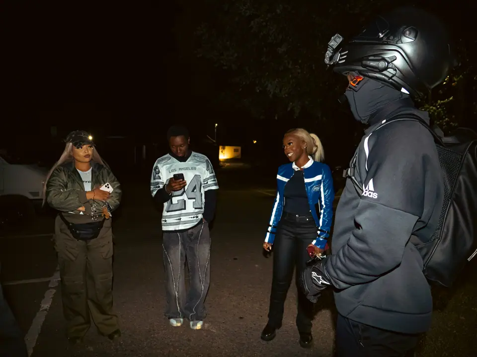 Late-night line-up in the car park