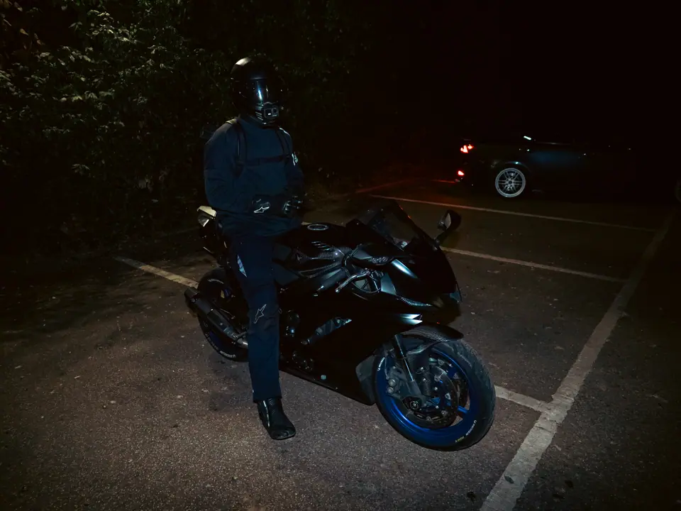 Rider and sports bike under flash